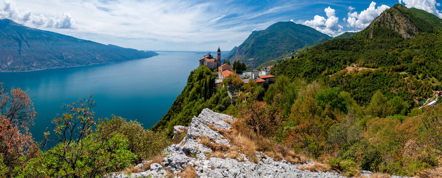 Lake Garda (Lago di Garda) with Pilgrimage church Madonna di Montecastello high above in the mountains near Tignale in Italy