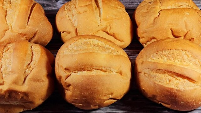Round hand sized hamburger burger bun baked, bun is a type of bread roll, typically filled with savory fillings, made from a dough of flour, milk, yeast, butter, usually stuffed with burger