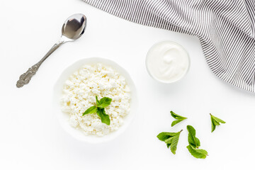 Farm cottage cheese in white bowl, top view. Healthy protein breakfast