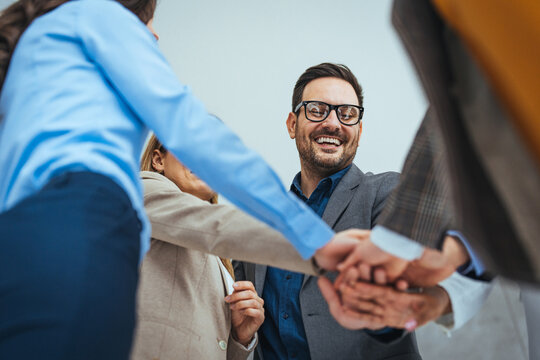 Team Celebrating Success with a Group Handshake