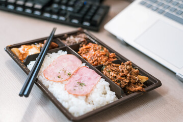 Busy Office Worker or Student in Korea Ready to Eat Convenience Store Lunch at Work Desk