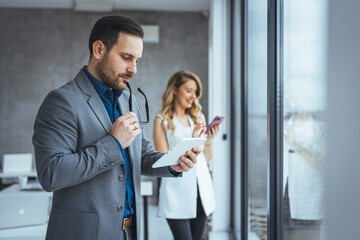Professional Business Team Working with Digital Devices in Office
