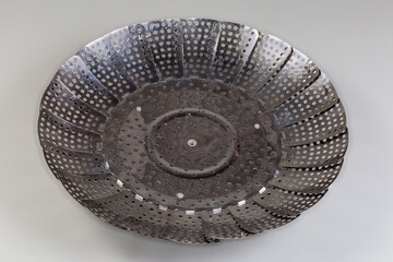 Steaming insert to the pan for steam cooking different food