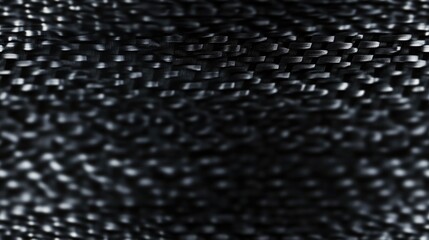 Seamless textured background of dark carbon fiber