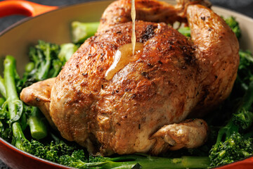 Roasted whole chicken with tenderstem broccoli peas and beans. Low carb food concept