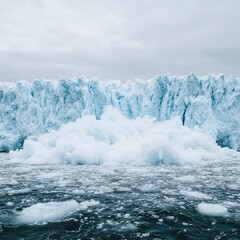 Icebergs floating in a serene ocean, showcasing the beauty of polar landscapes under a cloudy sky. A breathtaking view of nature's icy wonders.