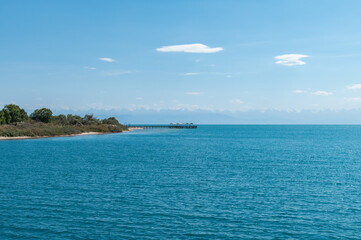 View of Lake Issyk-Kul and the beach of the city of Cholpon-Ata in Kyrgyzstan.
