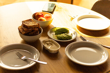breakfast, toast, avocado and peaches on the table
