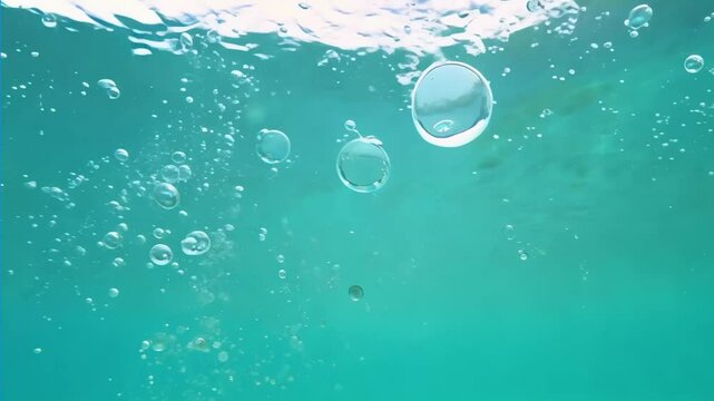 bubbles floating in transparent turquoise clear pool. Multitude of air bubbles rising through clear water