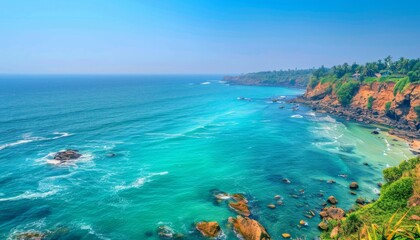 A picturesque view of the Varkala coast in Kerala, India, showcasing turquoise waters and majestic
