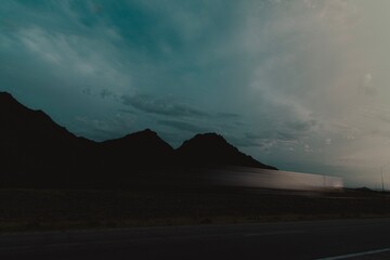 Shot of the mountains off the highway during dusk 