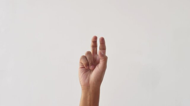 Asian male hands counting numbers one to ten on white background. hand gesture of an adult asian man showing the numbers one to ten on a white background. 4K slow motion footage.