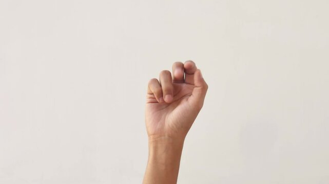Asian male hands counting numbers one to five on white background. hand gesture of an adult asian man showing the numbers one to five on a white background. 4K slow motion footage.