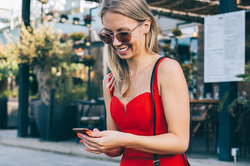 Stylish modern woman with phone on bench