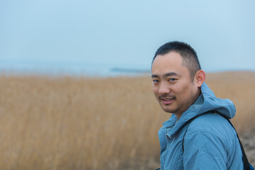 Chongming District, Shanghai - Young people on the beach under the blue sky