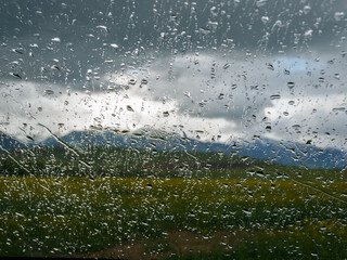 Raindrops flowing down the window.