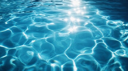 Obraz premium Rippling blue water, sunlight reflecting off the surface,