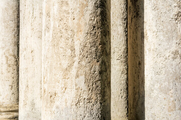 abstract architectural background - columns and walls made of light stone