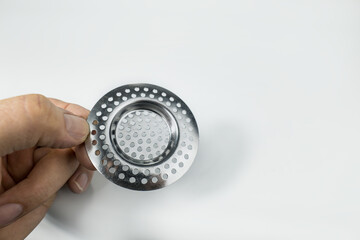 Sink stainless strainer on a white