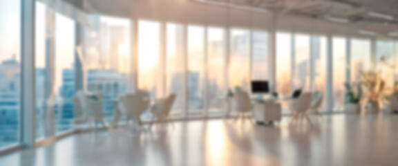 Obraz premium Softly blurred view of a sleek office space bathed in natural light from expansive windows, highlighting its modern design and ambient glow