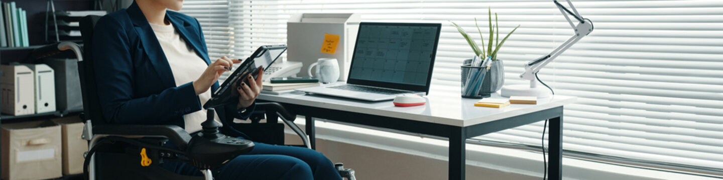 Header with woman with disability using digital tablet