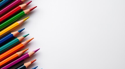 Colorful pencils arranged on a white background, perfect for art and creativity.