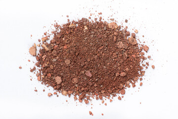 A mixture of different shades of eyeshadow on a white background.