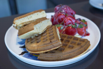 syrupy strawberries and waffles