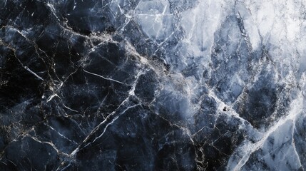 Textured black and blue marble featuring intricate white veining, creating a striking natural design.