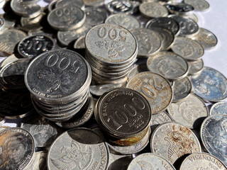 A pile of rupiah coins which is the currency of Indonesia