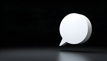 Minimalist white speech bubble on black background, symbolizing communication and conversation in a modern design