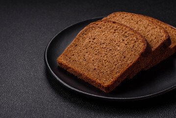 Fresh crispy brown bread sliced from whole grain flour - Powered by Adobe