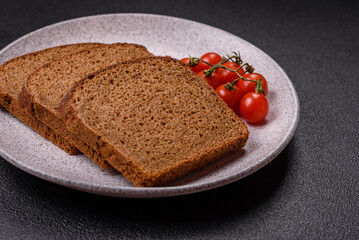 Fresh crispy brown bread sliced from whole grain flour