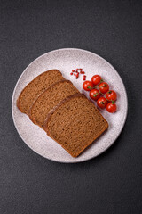Fresh crispy brown bread sliced from whole grain flour