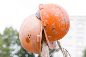 orange building helmet working equipment stuff dirty industrial objects close up view