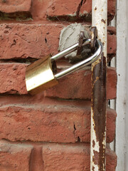 Vintage Padlock Securing a Metal Shutter, Symbolizing Security, Protection, and Industrial Strength with a Retro Aesthetic