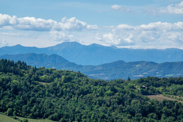 Fototapeta premium italian mountain landscape with trees and clouds