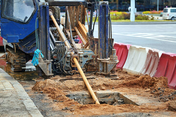 Horizontal directional drilling machine (HDD) in action, using the trenchless method for installing...