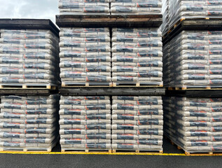 Warehouse with packed wooden pellets on pallets ready for shipment