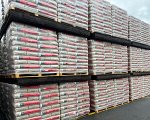 Warehouse with packed wooden pellets on pallets ready for shipment
