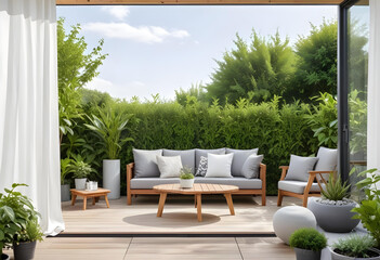Elegant outdoor seating set with wicker furniture and white cushions, surrounded by lush greenery on a wooden deck patio.
