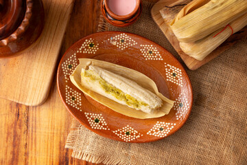 Tamales. hispanic dish typical of Mexico and some Latin American countries. Corn dough wrapped in...