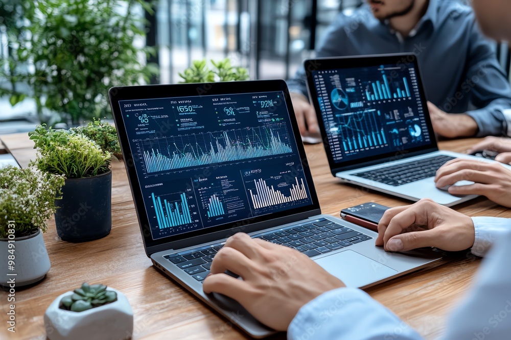 Aufkleber team of professionals working on laptops, with graphs and data streams showing business growth