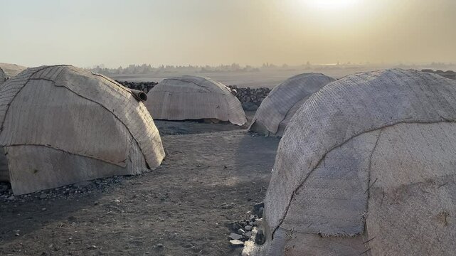Djibouti, camping at the dry lac Abbe in traditional huts in a extraordinary landscape