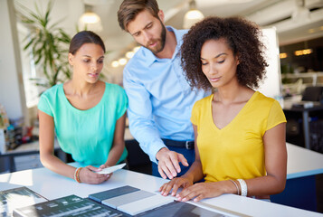 Business people, interior designers and panel with samples for renovation planning, material or project at office. Employees, colleagues or design team with texture for color range, choice or decor