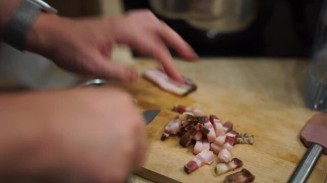 man cook husband cutting slicing bacon italian pancetta pasta carbonara homemade