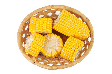 ear of corn in a wicker basket isolated on a white background. Top view. Flat lay