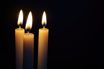Glowing Candlelight on Dark Background with Shallow Depth of Field