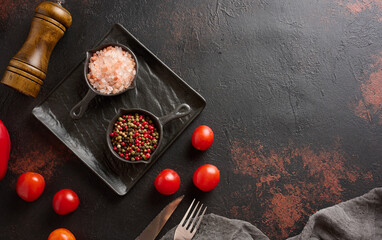 Culinary composition with kitchen utensils and spices, Himalayan salt, colorful peppercorns on the...