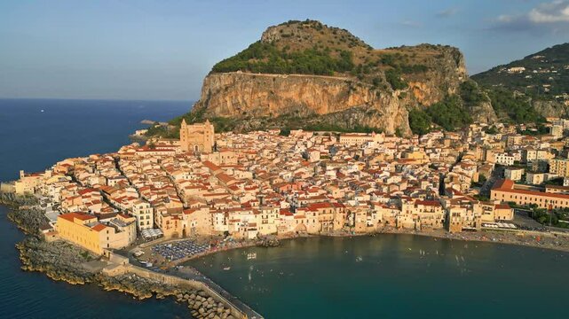 Cefal&ugrave; Bay. Pristine sea and Norman art. Immersed in nature and ancient history. Dream Sicily.